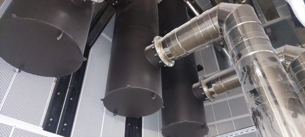 Acoustic silencer mounted on the exhaust of an industrial engine - noise reduction at gas outlet