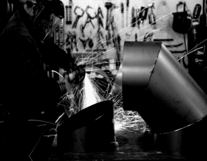 image of a welder assembling several parts.